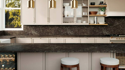 Modern kitchen featuring 514 Emprada countertop with warm earthy tones, crisscrossed chalky lines, and stylish barstools.
