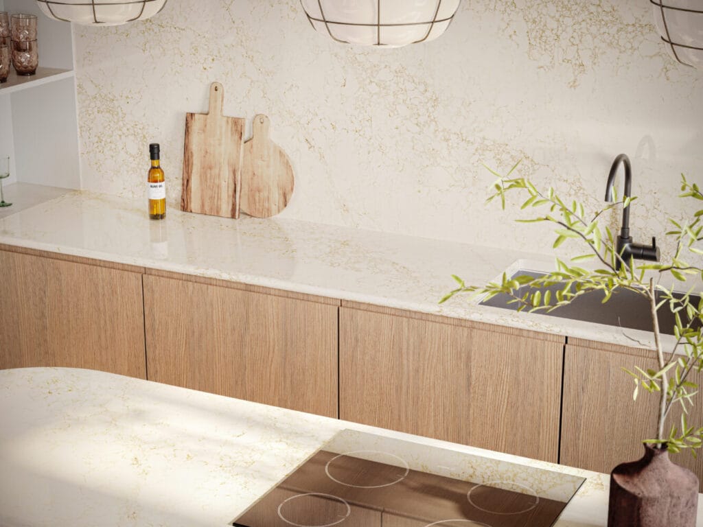Modern kitchen with white countertop featuring gilded veins, wooden cabinets, and elegant lighting.