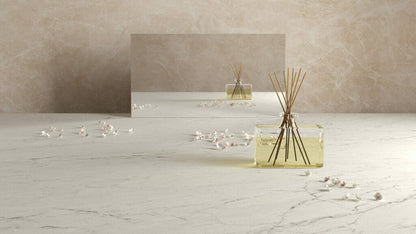Honed 580 Fume slab with cream veining, decorative diffuser, and serene ambiance for luxurious interiors.