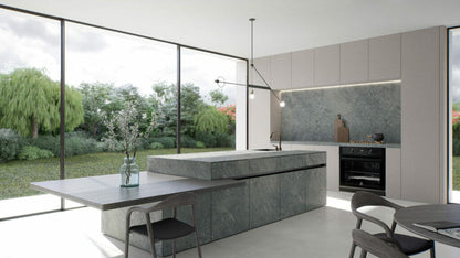 Modern kitchen featuring a sleek island with 533 Silverdrop surface, large windows, and a serene garden view.