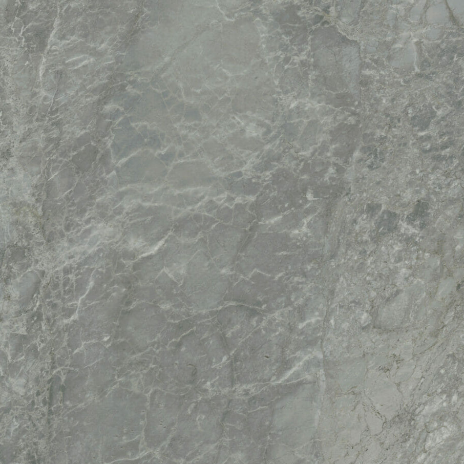 Honed finish 533 Silverdrop stone with pearl grey base and feathery seafoam veining, showcasing bluish undertones.