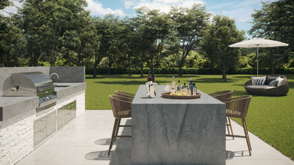 Stylish outdoor kitchen with elegant seating, sleek grill, and modern dining area surrounded by lush greenery.