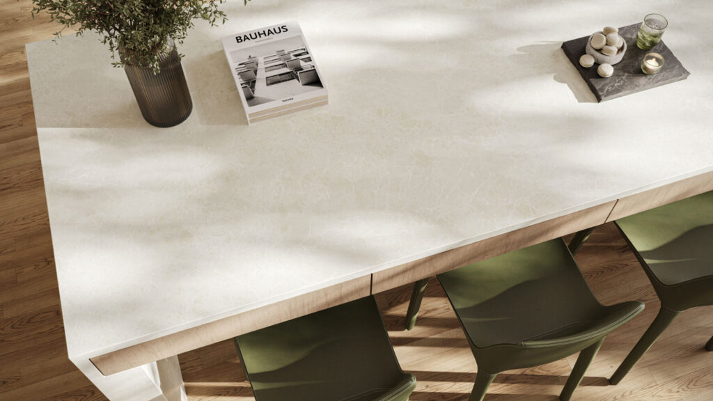 Elegant white dining table with green chairs, showcasing warm tones and luxurious finish, perfect for modern interiors.