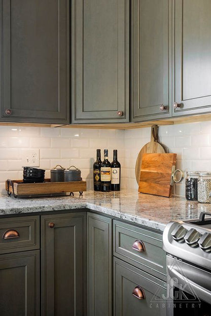 Modern kitchen featuring J&K cabinets crafted from 100% solid wood, elegant countertop, and stylish decor.