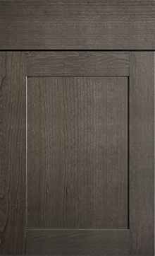 Close-up of Designer Collection Lakeland cabinet door in dark finish, showcasing elegant wood grain and craftsmanship.