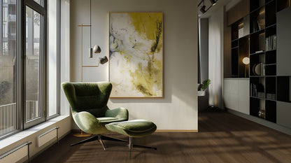 Modern living room featuring a green armchair, large windows, and abstract art on the wall for stylish decor inspiration.