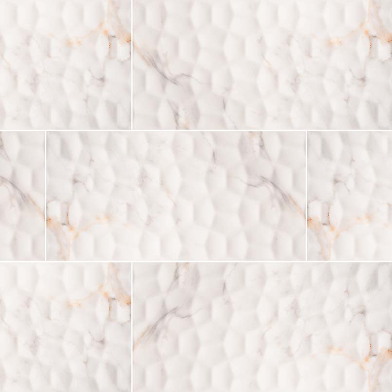 Adella Viso Calacatta large-format ceramic tile with textured relief and golden gray veins.