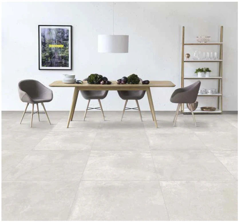 Elegant dining area featuring Apollo Pearl Mosaic Matt tiles, stylish chairs, and modern decor in a bright space.
