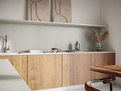 Modern kitchen featuring Brillianza stone with grey and white hues, wooden cabinetry, and minimalist decor.
