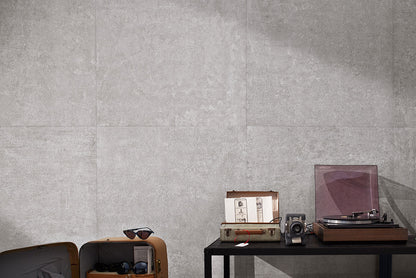 Concerto Grigio porcelain tile highlighting a modern indoor space with a vintage record player and stylish decor.