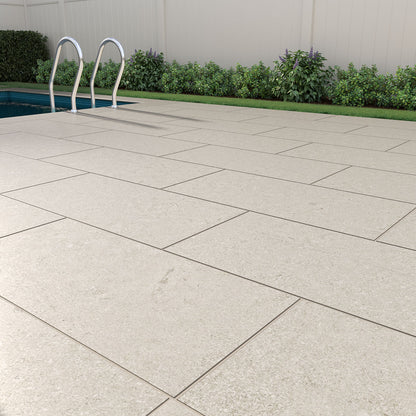 Livingstyle Pearl 18x36 Matte porcelain pavers showcasing a soft gray tone, ideal for patios and pool surrounds.